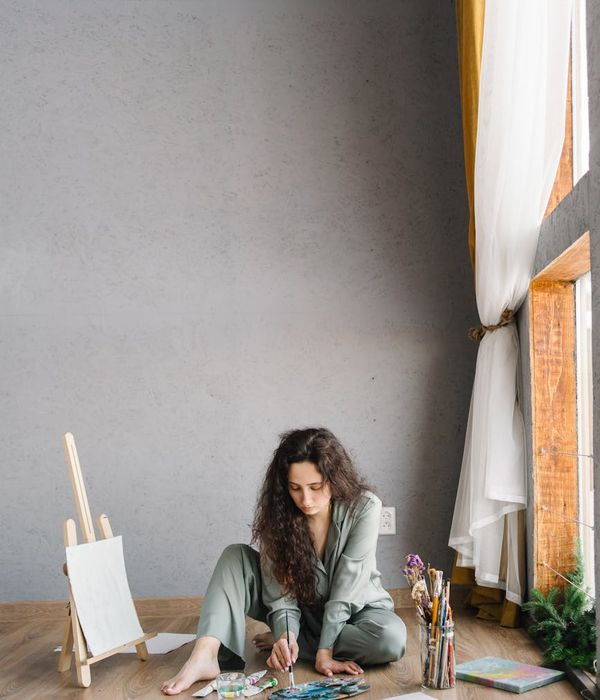 Person meditating peacefully in a brightly lit room.